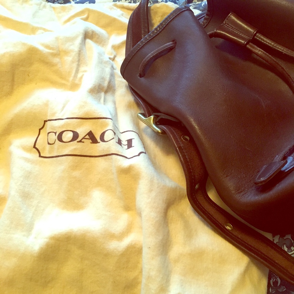 Dark brown leather purse. With serial number